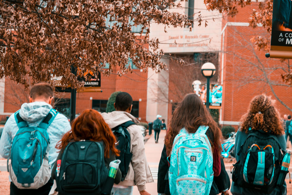 A group of college students heading into class
