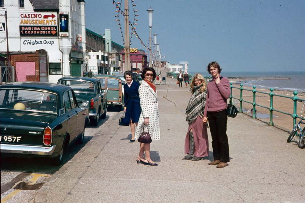 A vintage photo of some folks at the seaside in the 1970s