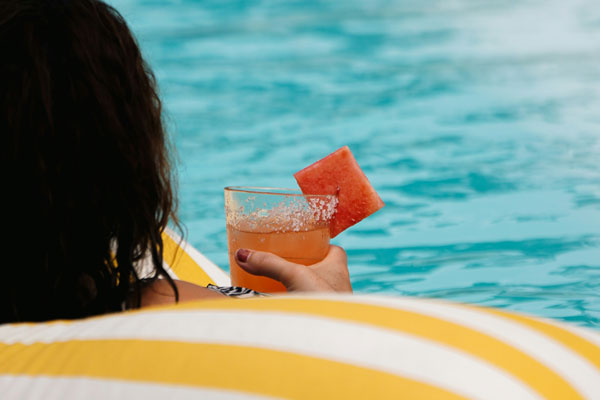 Keeping your smile safe on holiday A cool drink by the pool
