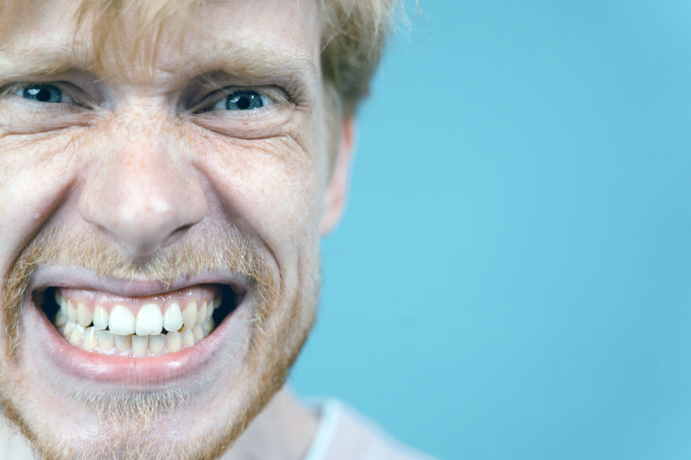 A ginger gentleman grinding his teeth